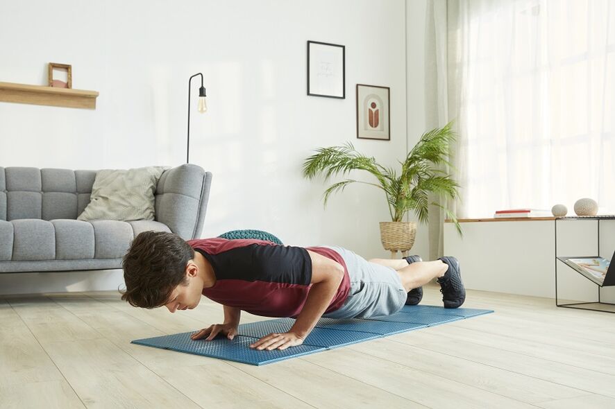 Stand on the plank to work the press and back muscles